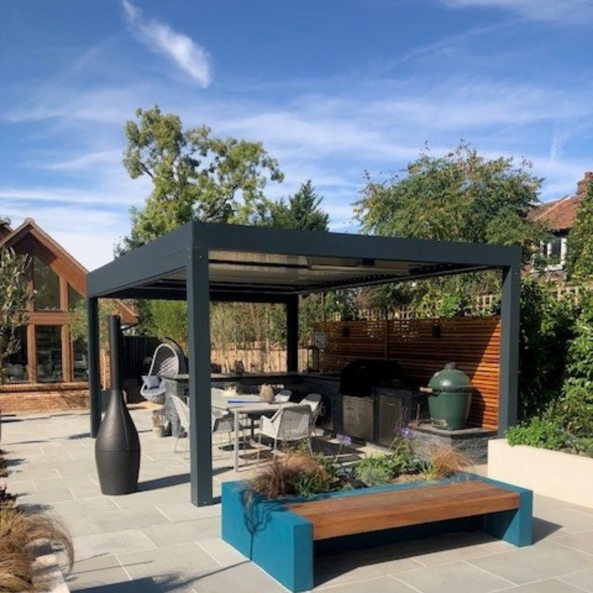 Garden structures including bioclimatic pergolas available from Cedar Nursery, Surrey