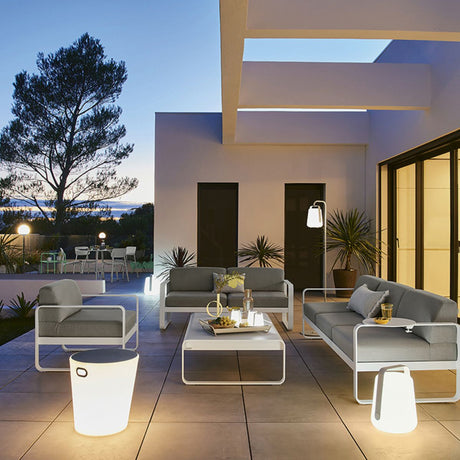 The Fermob Inoui Lighting Stool looks stunning in your garden at night